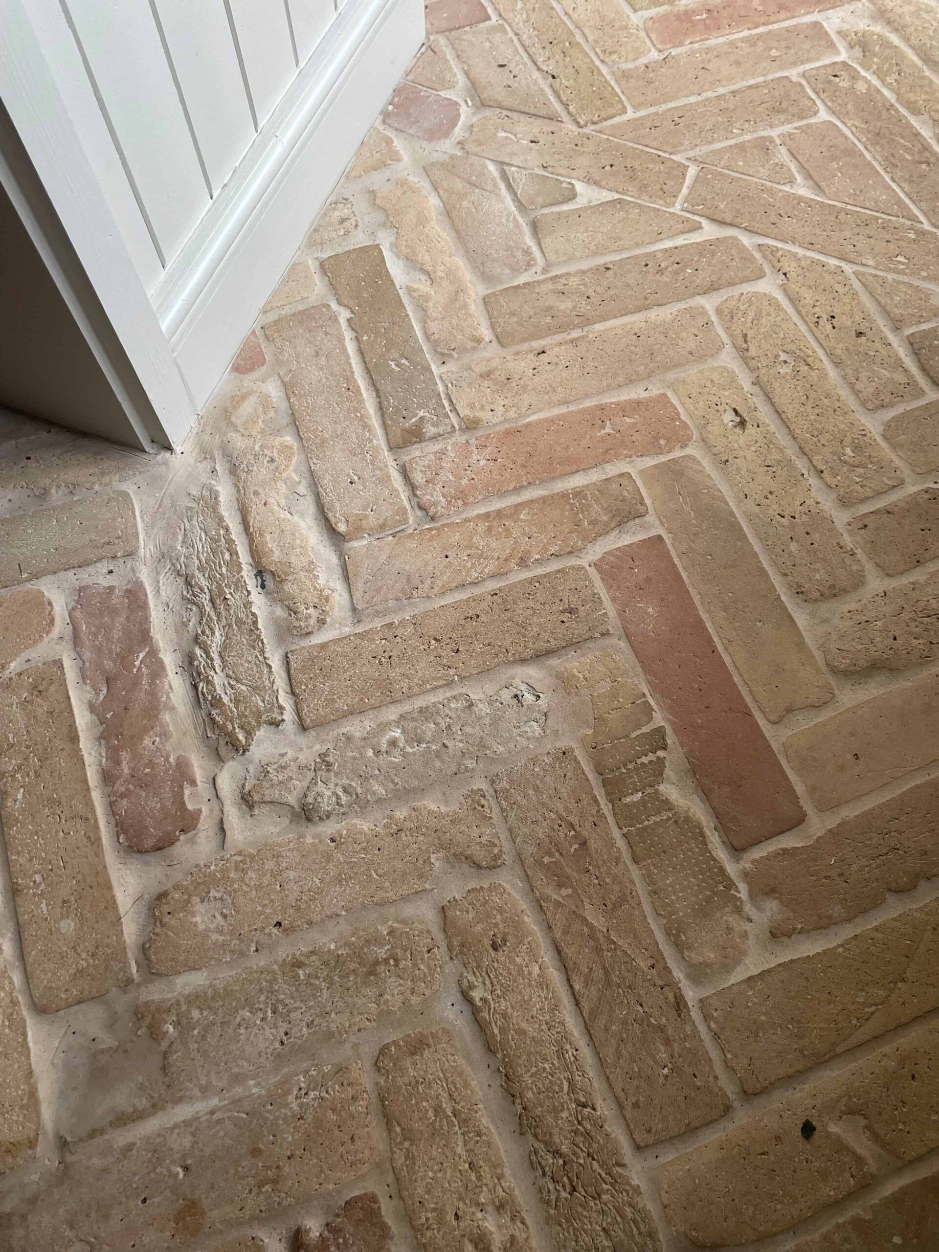 Light herringbone brick tile